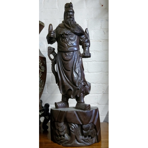 46 - A very large Chinese carving of warlord Guan Yu, early 20th century, padouk wood, very large and hea... 