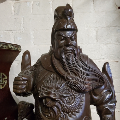 46 - A very large Chinese carving of warlord Guan Yu, early 20th century, padouk wood, very large and hea... 