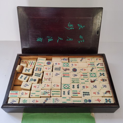 49 - A complete Chinese bamboo and bone cased Mah Jong set, with instuctions & rule book. 20th centur... 