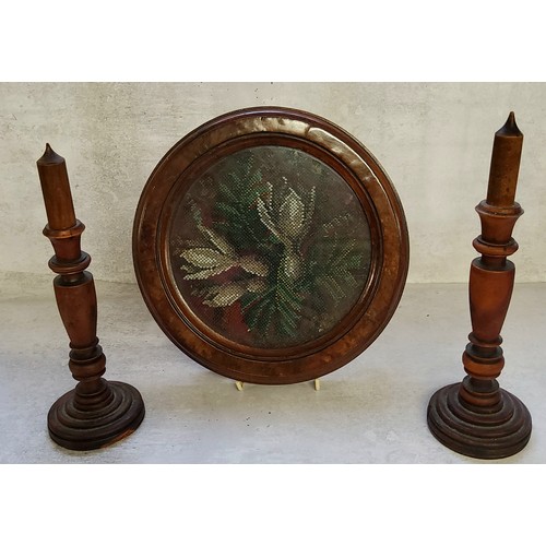 99 - A Victorian beadwork circular panel in a period moulded burr walnut frame mounted on four bun feet; ... 