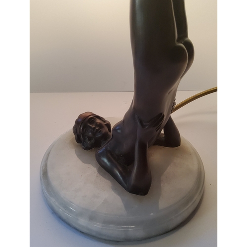 103 - An Art Deco type bronzed table lamp, with gymnastic pose column, frosted globe shade.