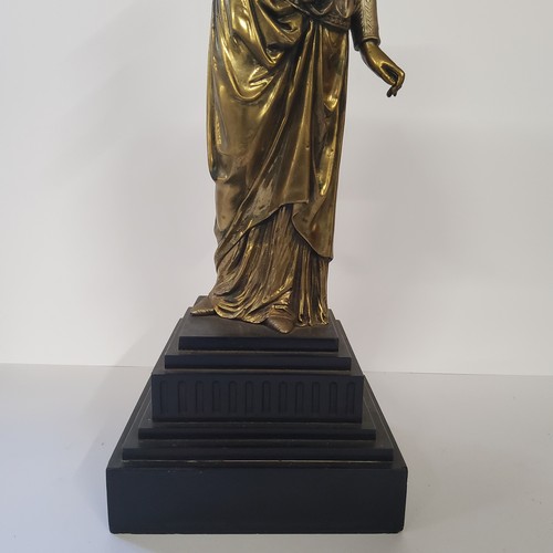 137 - A French bronze figure of a classical maiden, raised on a stepped black marble base, 50cms high