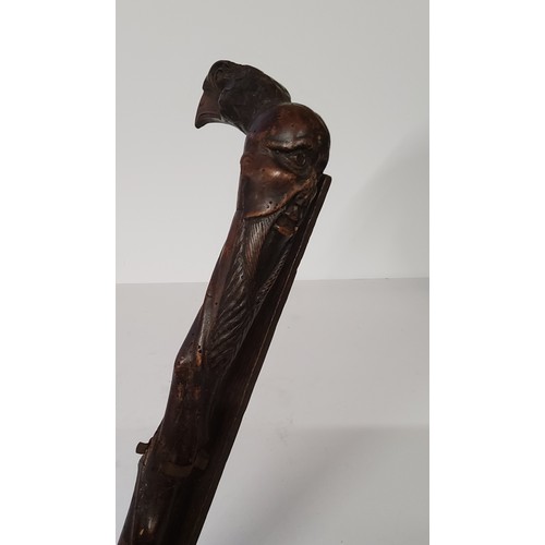 50 - Oriental - an early Japanese walking cane carved with a bearded elder and golden eagle mask pommel o... 