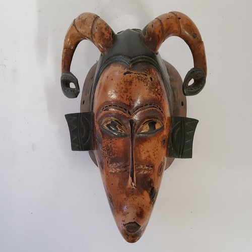 93 - Tribal Art - A Guro zamble mask from the Ivory Coast, with typical regional qualities of blended ant... 