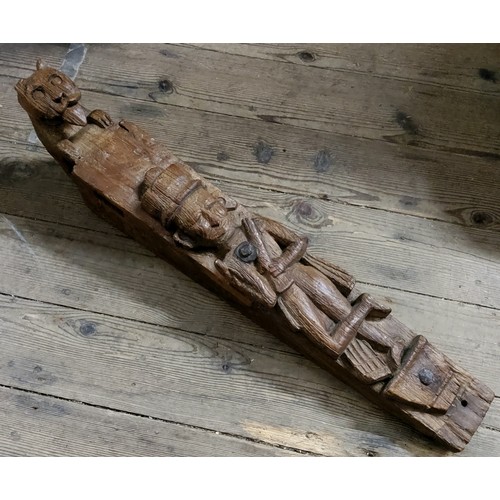 97 - An early Colonial hardwood caryatid carved wall bracket in the form of a warrior bearing rifle, with... 