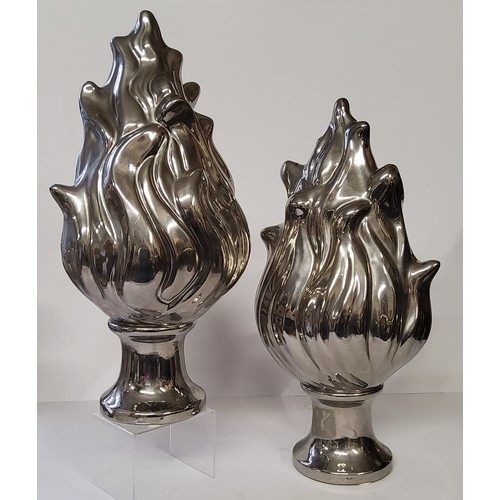 100 - A pair of contemporary silver glazed ceramic torch shaped ornamental finials by Eichholtz. 41cm high