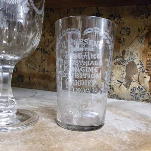 131 - A near pair of Victorian beakers etched A present from the fine art industrial & maritime exhibi... 