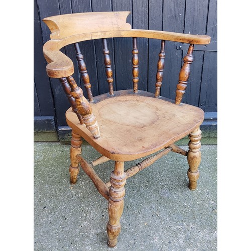 357 - A Victorian farmhouse ash and elm bow back captains chair c.1900.