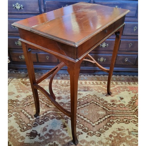 359 - An Edwardian campaign style mahogany writing desk, the hinged rectangular top with sliding mechanism... 