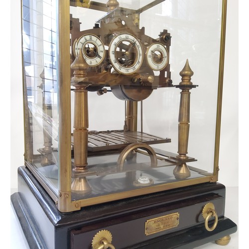 51A - A Congreve rolling ball clock, three white enamelled chapter rings, black Arabic numerals, the fusee... 