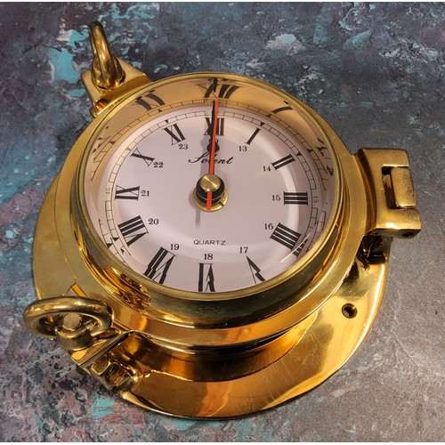 A Solent solid brass porthole clock, screw down hinged cover
