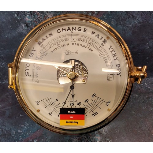 20 - A Franz Hermle Brass Percision Barometer,  in the style of a ships port hole, NOS, with original pac... 