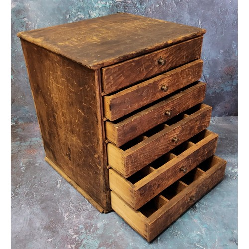 23 - An early 20th century watchmaker's or collector's bank of six graduated pine drawers, 35cm high x 30... 