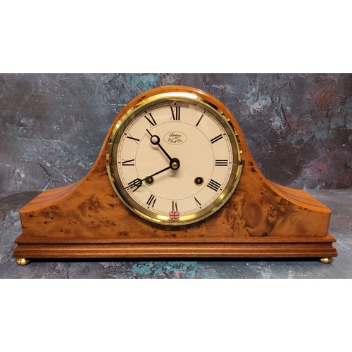 42 - A Britains Clock Co. Napolean Hat mantel clock, walnut finish, cream dial, black Roman numerals, twi... 