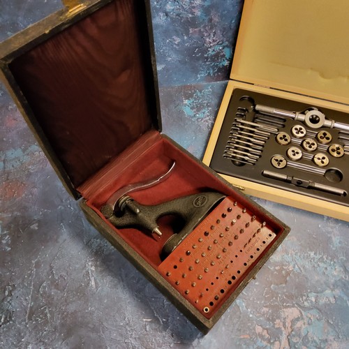 83 - Watchmaker's Tools - a Pierre Seitz jeweling tool,boxed; an L.A.L Ltd tap & die set,boxed (2)