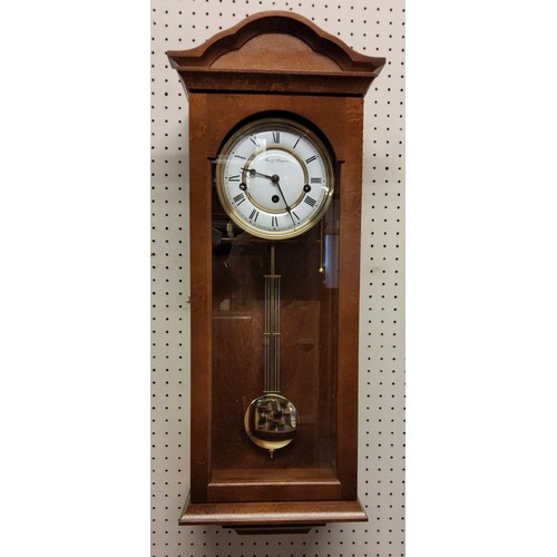 91 - A Fox & Simpson golden oak finish wall clock, 8 day movement, 4/4 chime, automatic night shut of... 