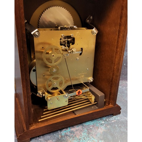 93 - A Hermle mahogany mantel clock, 8-day 4/4 Westminster striking mechanism with automatic night s... 