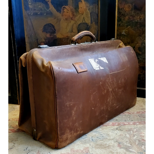 130 - An early 20th century leather Gladstone bag