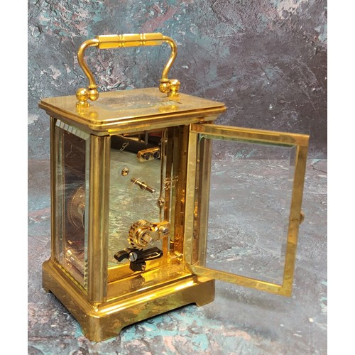 134 - A brass carriage clock, 11 jewel movement, bevelled glass and small top panel, white dial, black Rom... 