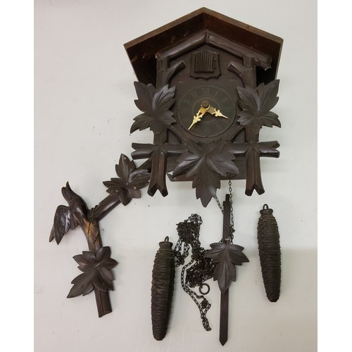 161 - A German wall clock, Roman numerals, striking on bell, c.1890;  an early 20th cuckcoo clock;&nb... 