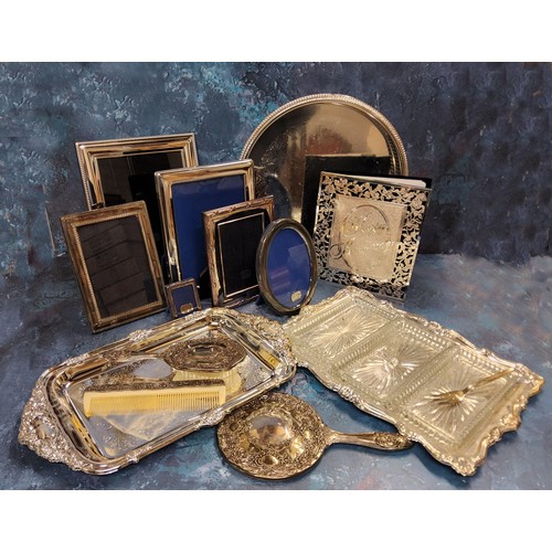 221 - Silverplate including photograph frames of various sizes, circular gallery tray, dressing table set,... 