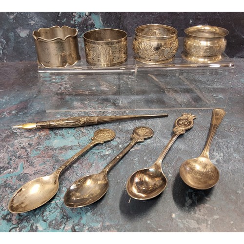 228 - A silver napkin ring, Chester 1921;  others;  silver golfing tea spoons;  etc, 137g, ... 