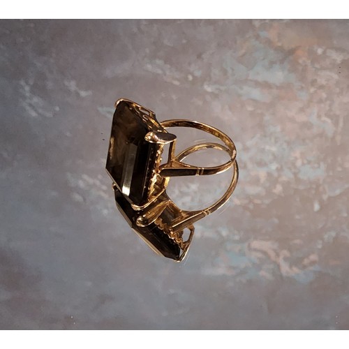 230 - A large smokey quartz ring, emerald cut, 9ct gold mount