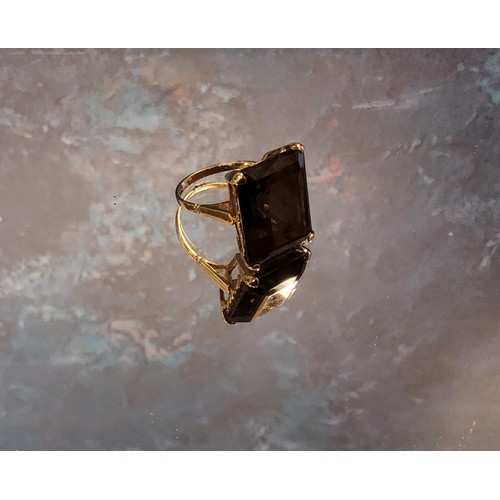 230 - A large smokey quartz ring, emerald cut, 9ct gold mount