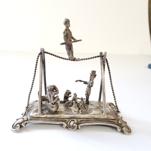 253 - A good Dutch silver miniature diorama of a circus & ringmaster including trapeze artist, a chimp... 