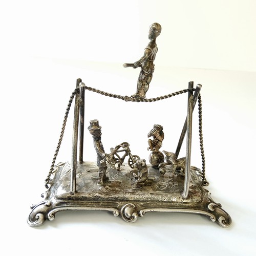 253 - A good Dutch silver miniature diorama of a circus & ringmaster including trapeze artist, a chimp... 