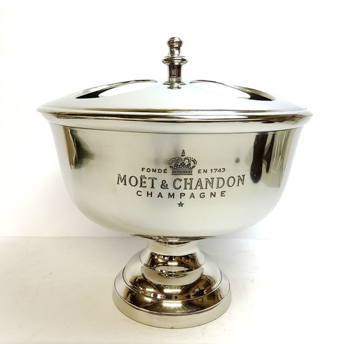 222A - A large Moet Chandon centre piece ice bucket and champagne holder, the lift off cover with four bott... 