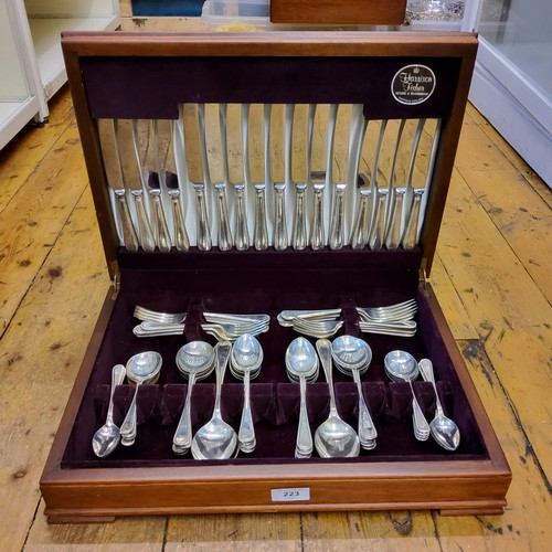 223 - A Harrison Fisher Beaded Old English pattern canteen, for eight, cased (four dessert knives lacking)