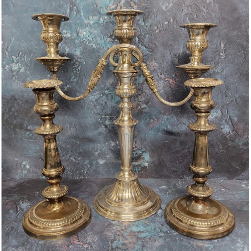 220A - An E.P.N.S.  two-branch, three light candelabra, 38cm high; a a pair of EP on Copper table cand... 