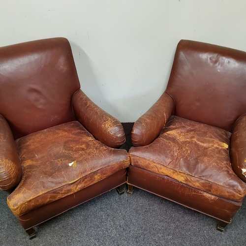 481 - A pair of early 20th century leather club chairs circa. 1920