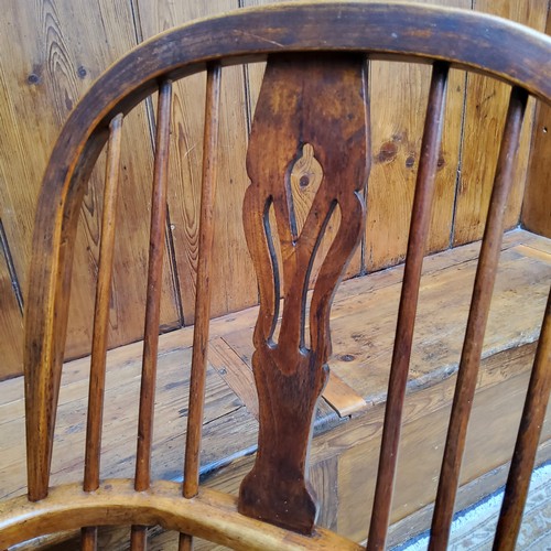 7 - An early 19th century ash and elm Windsor chair, crinoline stretcher, c.1820