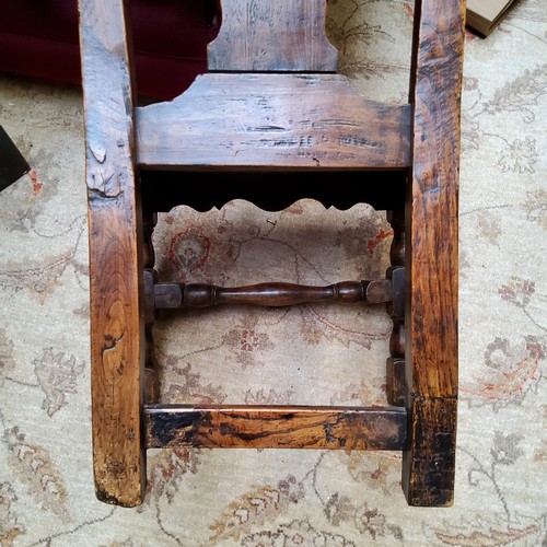 10 - An early 18th century Queen Anne oak side chair, pierced vasular splat, solid seat, turned stretcher... 