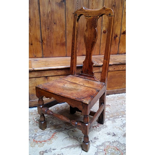 10 - An early 18th century Queen Anne oak side chair, pierced vasular splat, solid seat, turned stretcher... 