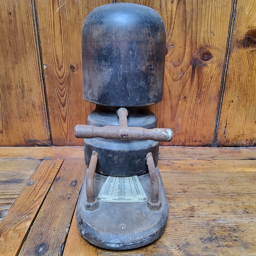 11 - A Victorian fruitwood milliner's hat stretcher, the wrought iron handle dividing the block according... 