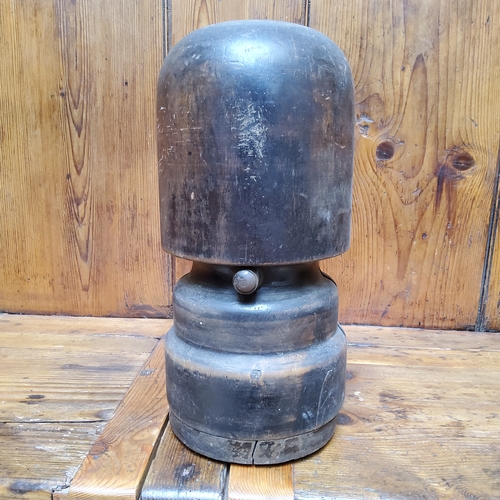 11 - A Victorian fruitwood milliner's hat stretcher, the wrought iron handle dividing the block according... 