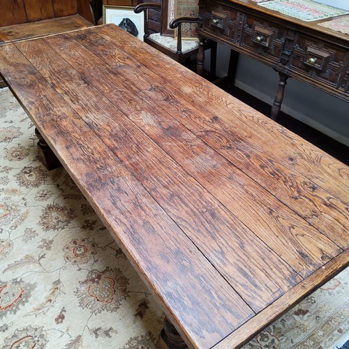 18 - A 19th century English oak Refectory dining table, cup and cover legs, central refectory H stretcher... 