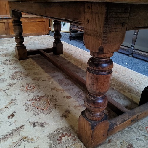 18 - A 19th century English oak Refectory dining table, cup and cover legs, central refectory H stretcher... 