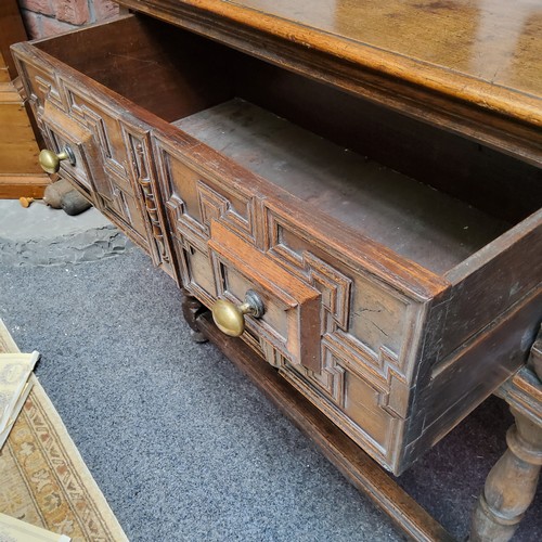 20 - A Charles II Revival oak block front dresser base, moulded rectangular top, the frieze fitted with t... 