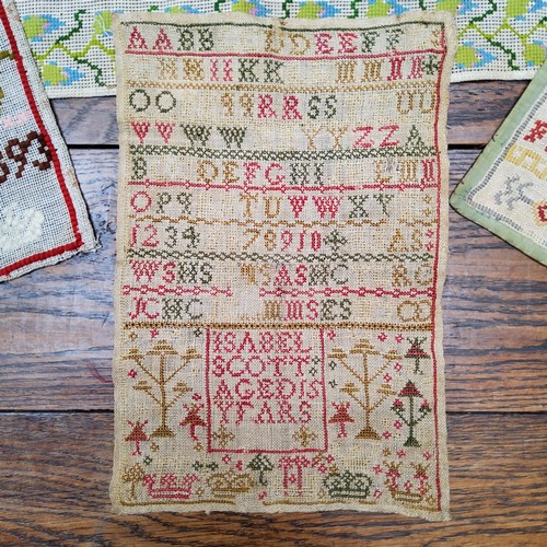 22 - A Victorian needlework sampler, embroidered by Florence C Milbank, 1873. with alphabet, 28cm squared... 