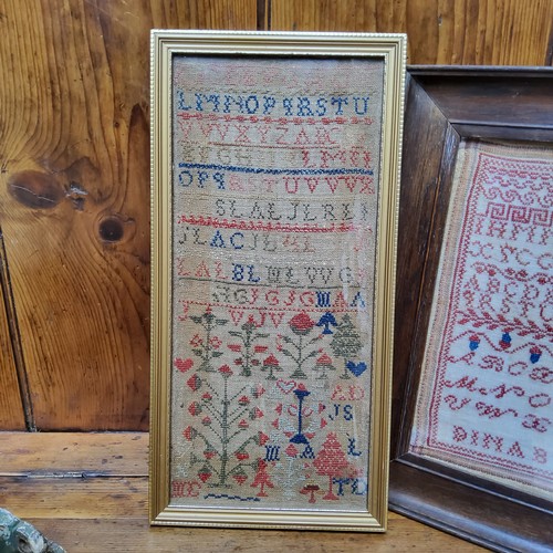 24 - A Victorian needlework sampler, embroidered with alphabet, numbers, acorns and foliage, dated 1876, ... 