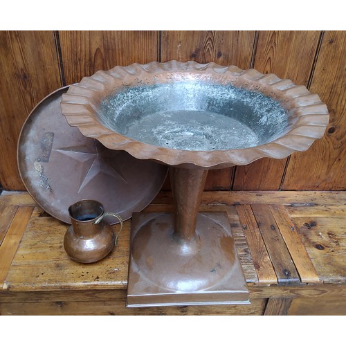 39 - An unusual Arts & Crafts period hammered copper pedestal fountain/urn, flared bowl with undulati... 