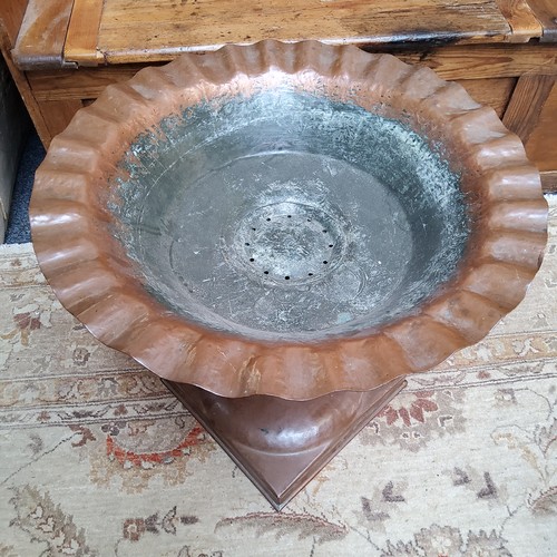 39 - An unusual Arts & Crafts period hammered copper pedestal fountain/urn, flared bowl with undulati... 