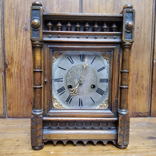 49 - An Arts and Crafts mahogany mantel clock, silver dial with Roman numeral, the rectangular case with ... 