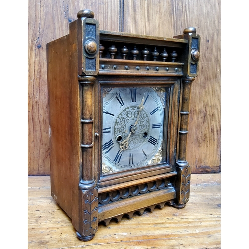 49 - An Arts and Crafts mahogany mantel clock, silver dial with Roman numeral, the rectangular case with ... 