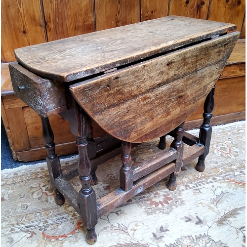 55 - An 18th century English oak drop leaf gateleg tavern table, drawer to frieze, turned supports c.1750... 