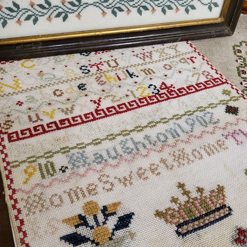 72 - A Victorian sampler, embroidered by Wendy Anne Gorser 1898, with alphabet, stag, deer, trees, foliag... 